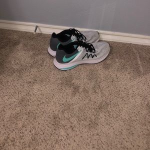 White and blue Nike running shoes